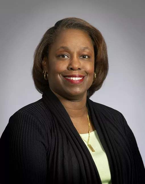 headshot of Huntley 