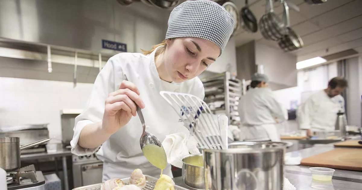 Student preparing food.