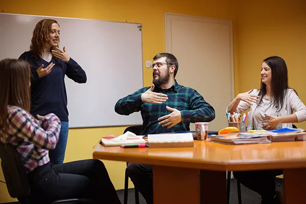 students participating in American Sign Language class