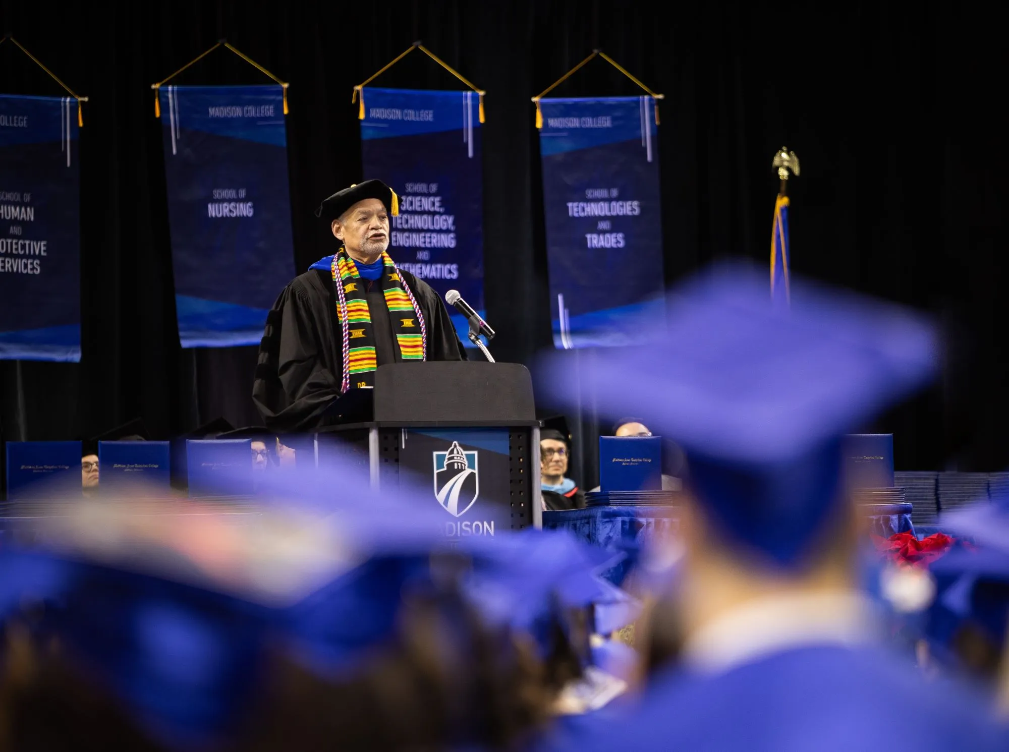 President Daniels on stage at 2024 commencement looking out over the audience.